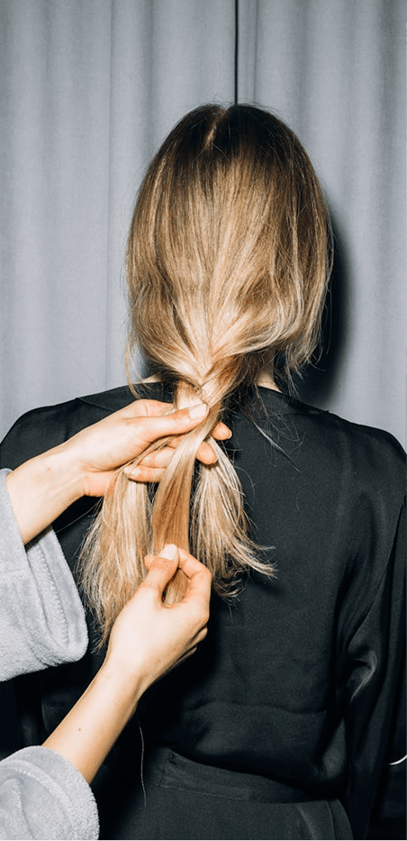 Woman having hair styled